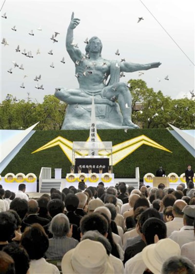 Doves fly during a ceremony held in front of the Statue of Peace at Nagasaki Peace Park in Nagasaki, southern Japan Tuesday, Aug. 9, 2011 to mark the 66th anniversary of the world's second atomic bomb attack.  (AP Photo/Kyodo News) JAPAN OUT, MANDATORY CREDIT, NO LICENSING IN CHINA, FRANCE, HONG KONG, JAPAN AND SOUTH KOREA